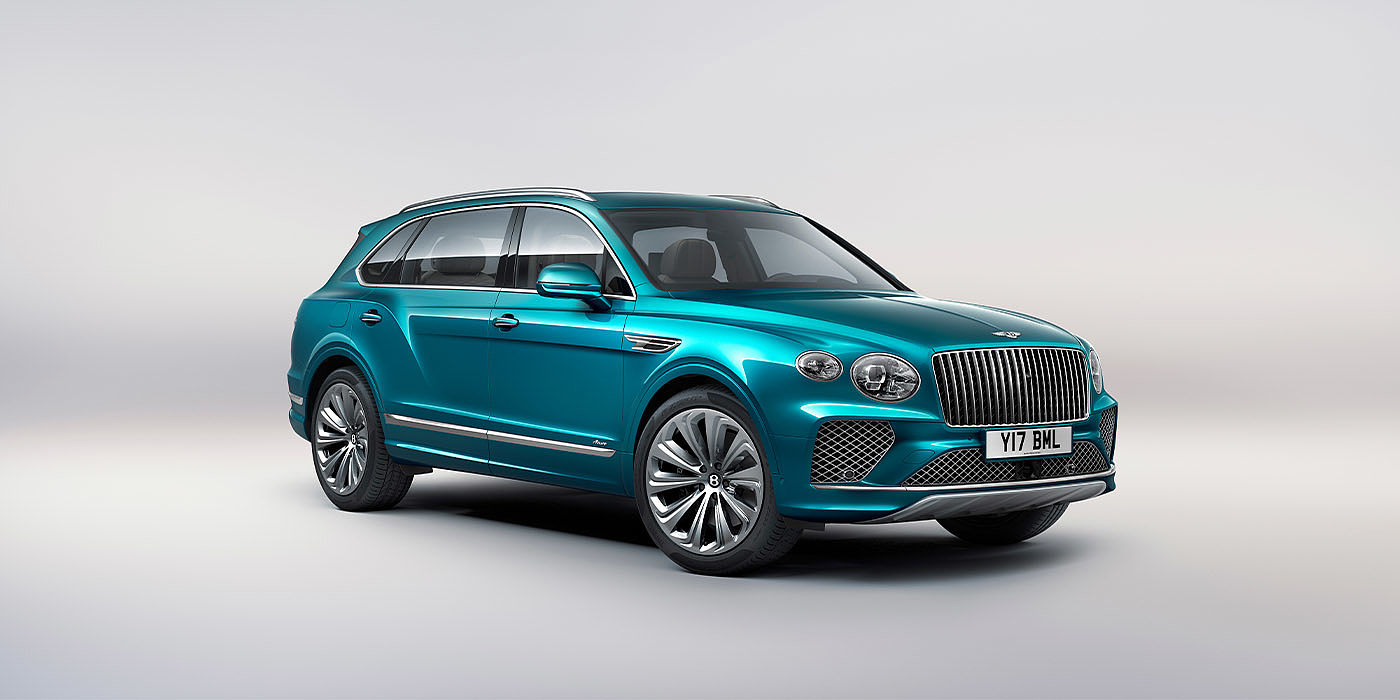 Bentley Barcelona Bentley Bentayga EWB Azure front three-quarter view, featuring a fluted chrome grille with a matrix lower grille and chrome accents in Topaz blue paint.