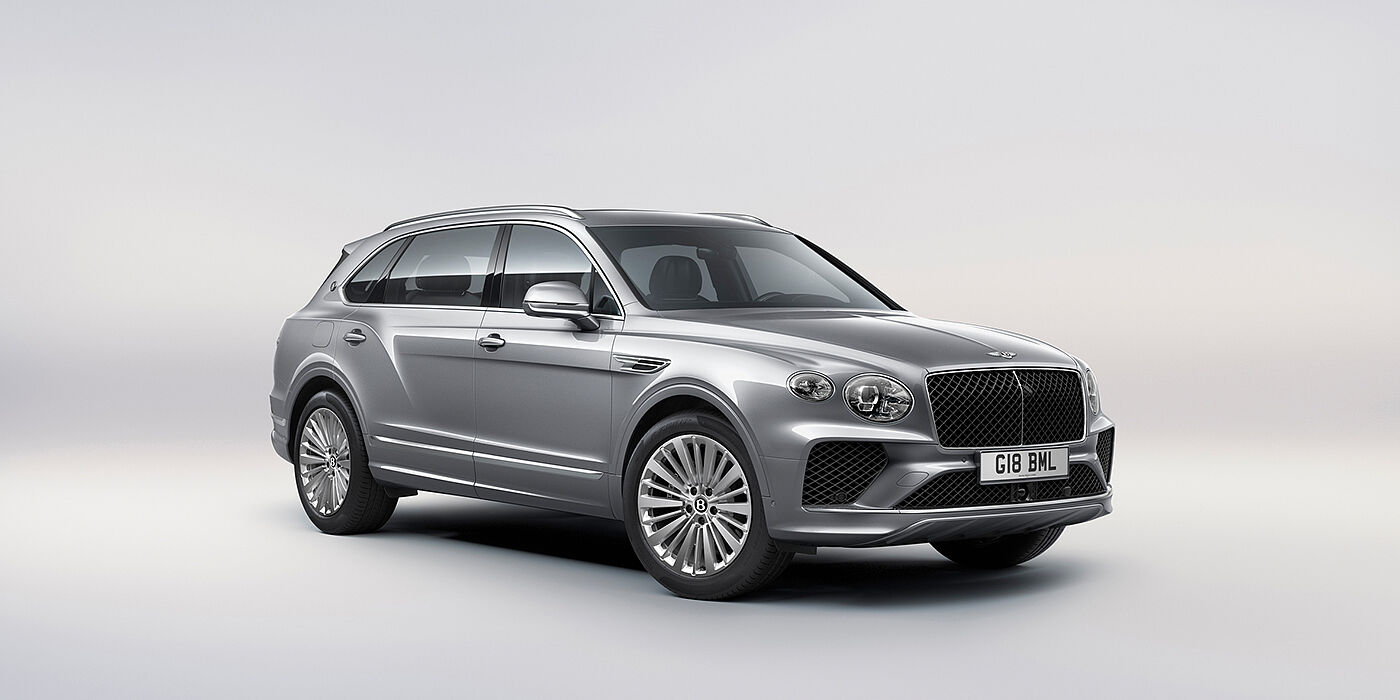 Bentley Barcelona Bentley Bentayga Extended Wheelbase luxury SUV front three quarter view in Moonbeam paint with 21 inch five spoke painted wheels