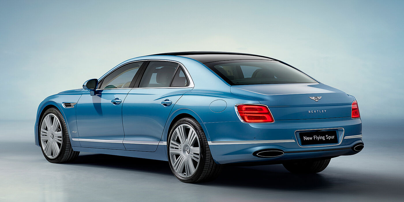 Bentley Barcelona New Bentley Flying Spur Azure sedan rear view in Light windsor blue by Mulliner paint with 22 inch Azure wheels and chrome exterior details