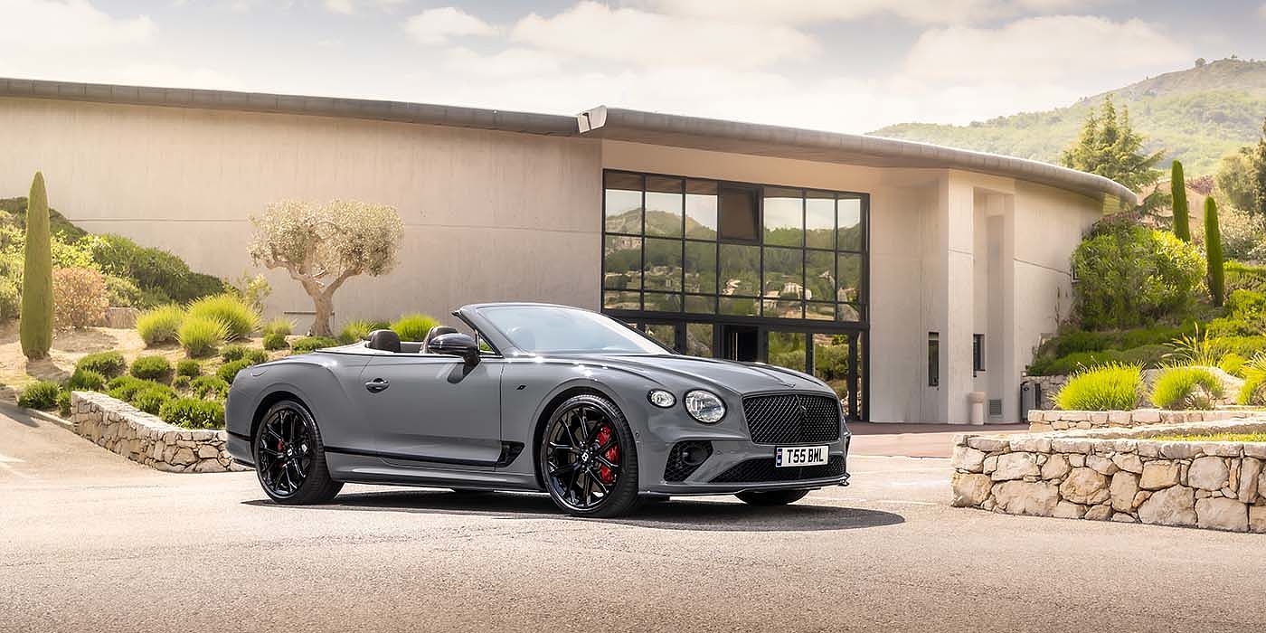 Bentley Barcelona Bentley Continental GTC S convertible in Cambrian Grey paint front 34 static near house