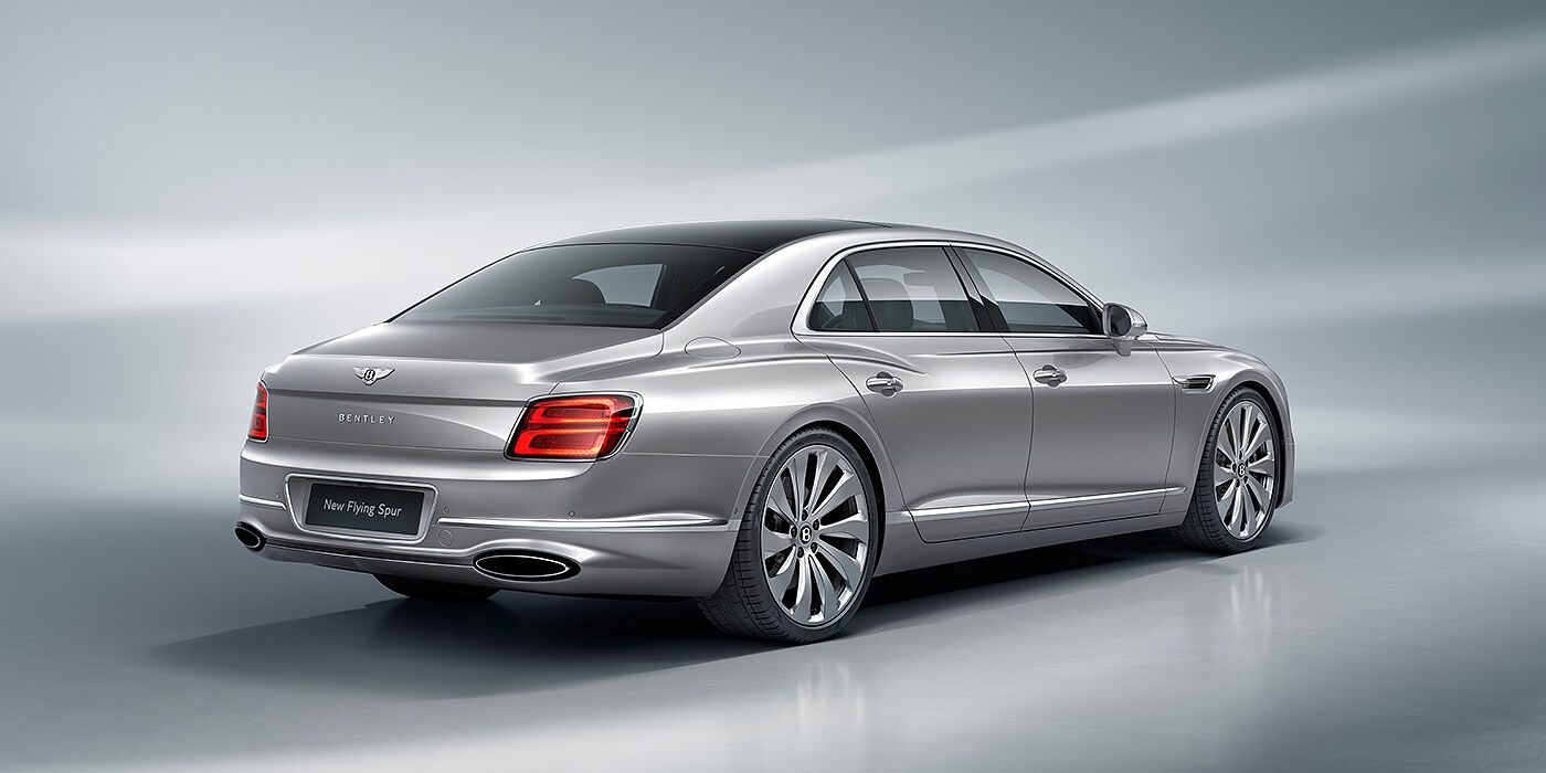 Bentley Barcelona New Bentley Flying Spur sedan rear view in Silverlake paint with ten spoke wheels and chrome matrix grille