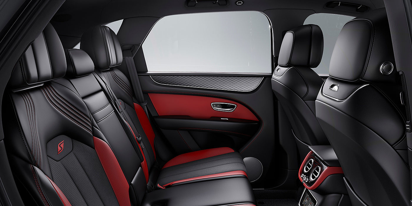 Bentley Barcelona Bentey Bentayga S interior view for rear passengers with Beluga black and Hotspur red coloured hide.