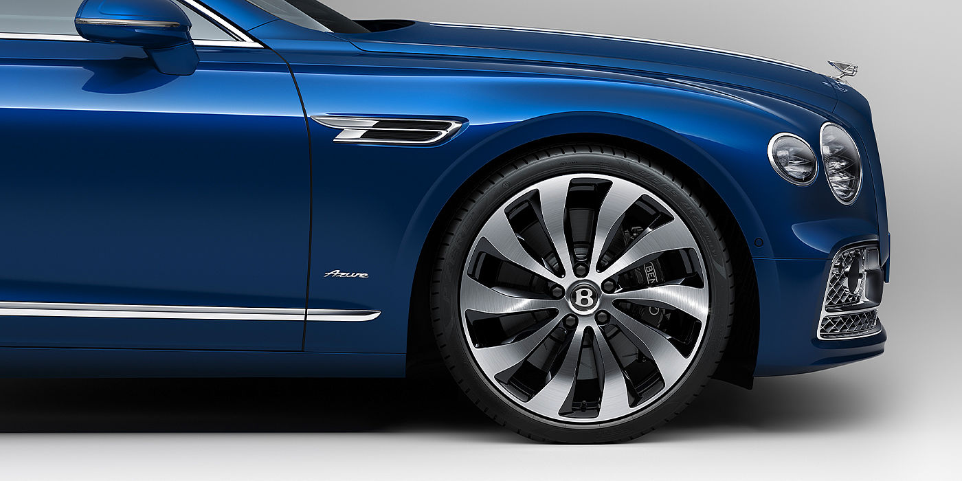 Bentley Barcelona Bentley Flying Spur Azure sedan side close up in Sequin Blue paint with Azure badge