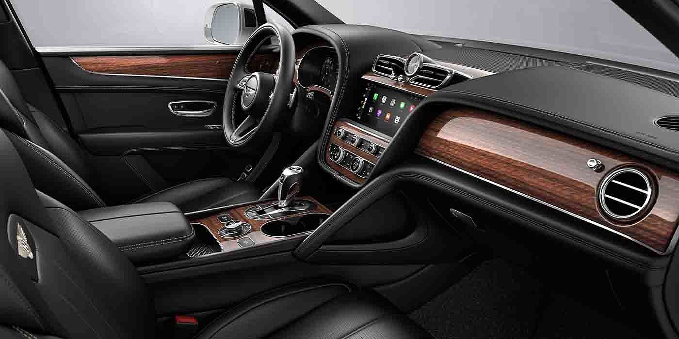 Bentley Barcelona Bentley Bentayga EWB interior with a Crown Cut Walnut veneer, view from the passenger seat over looking the driver's seat.