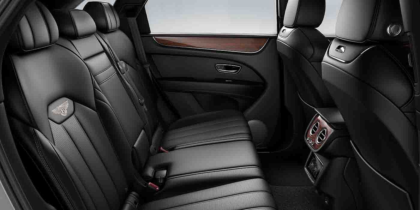 Bentley Barcelona Bentley Bentayga EWB interior view for rear passengers with Beluga black hide.