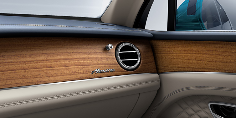 Bentley Barcelona Bentley Bentayga Extended Wheelbase Azure front dash showing Open Pore Koa veneer surrounded by Portland and Imperial Blue hides