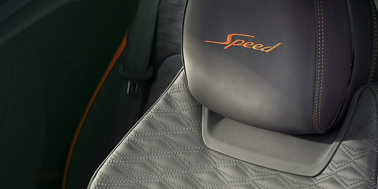 Bentley Barcelona Bentley Continental GT Speed coupe seat detail in Gravity Grey hide and Speed emblem in Mandarin by Mulliner coloured embroidery