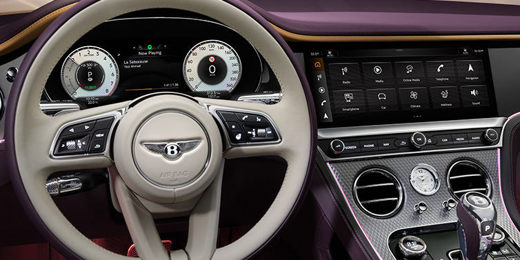 Bentley Barcelona Bentley Continental GTC Mulliner convertible steering wheel and drivers screens surrounded by Damson purple and Linen hides